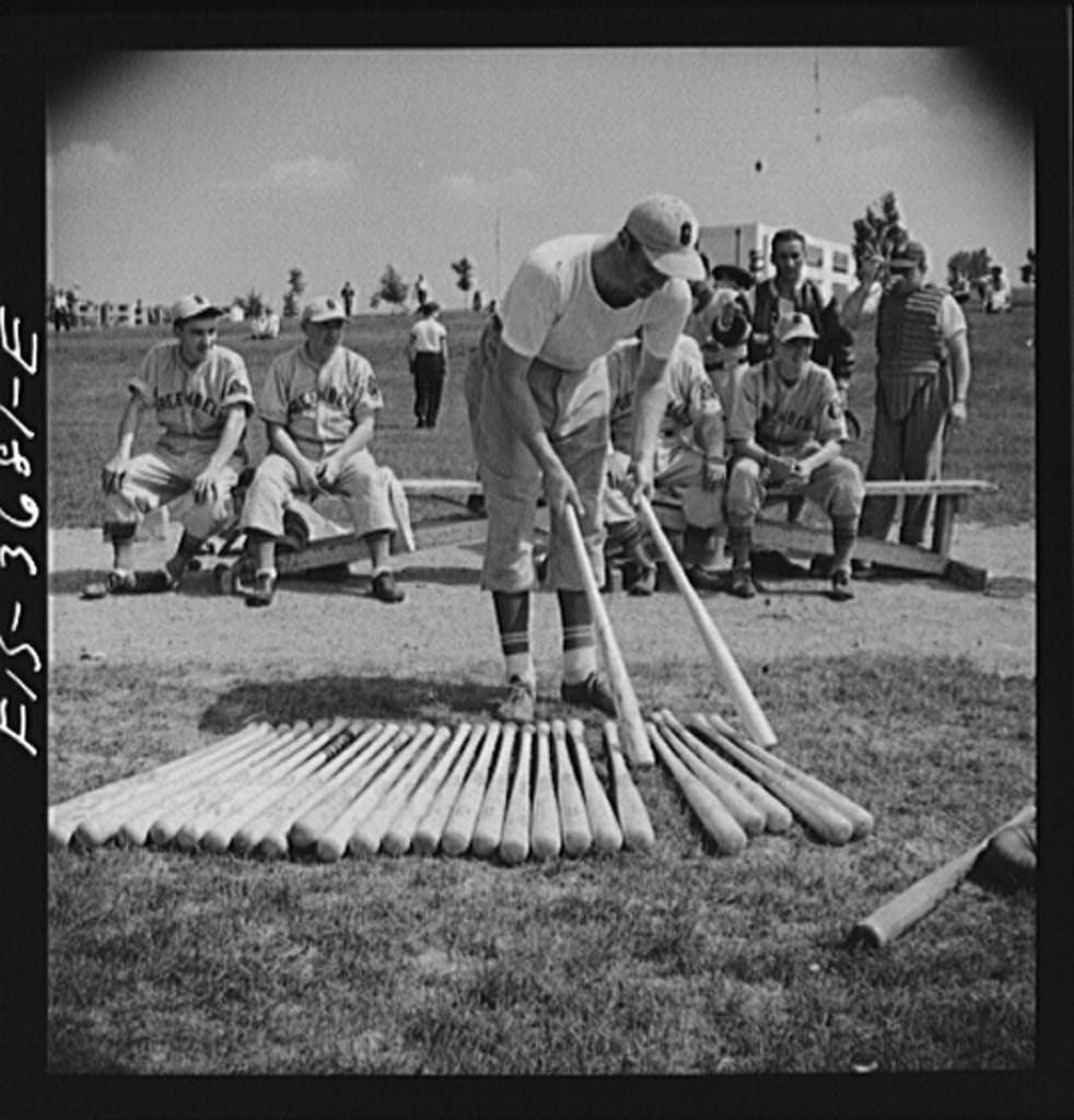 Member of the Greenbelt baseball team picking out a bat 8d21113v